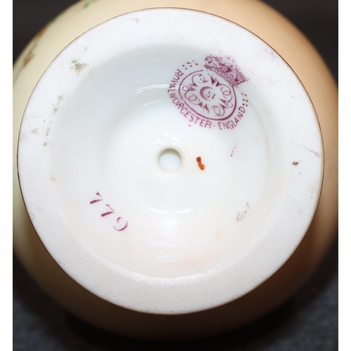 116 - A Royal Worcester blush round bulbous thin necked jug with multi-coloured floral, leaf and gilt deco... 