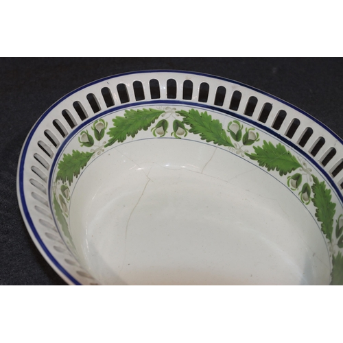 123 - An early Wedgwood Creamware oval bowl with pierced rim on cream and green ground with leaf decoratio... 