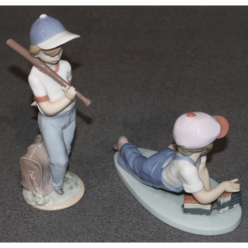 128 - A Lladro figure of a young boy holding a baseball bat, 21cm high (boxed) and another Lladro figure o... 