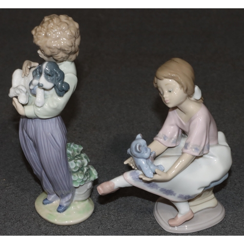 130 - A Lladro figure of a young seated girl holding a teddy bear, 16cm high (boxed) and a Lladro figure o... 