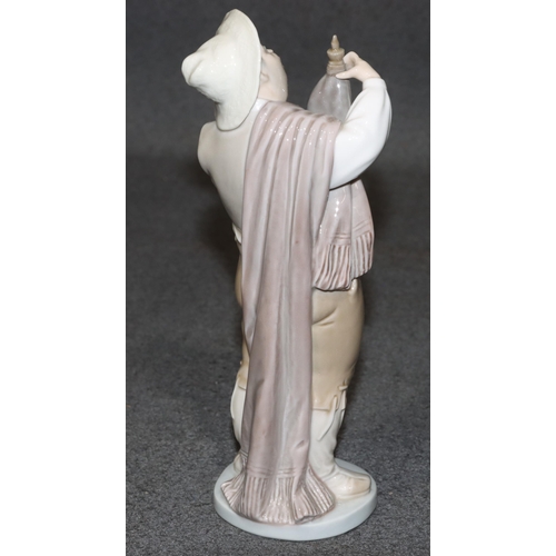 134 - A Lladro figure of a standing gentleman holding a water bottle, 21cm high