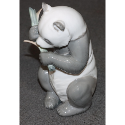 136 - A Nao figure of a seated panda, 16.5cm high