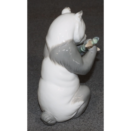 136 - A Nao figure of a seated panda, 16.5cm high