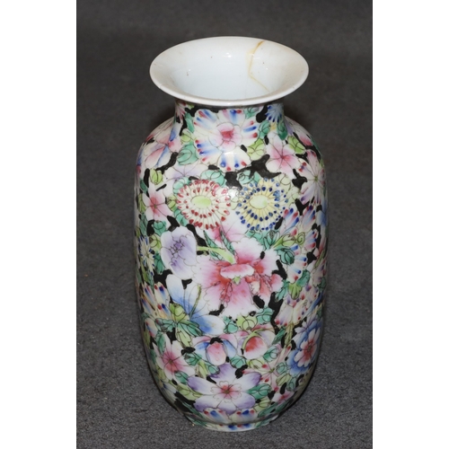 144 - An Oriental round bulbous thin necked trumpet shaped vase on multi-coloured floral, leaf ground, 20c... 