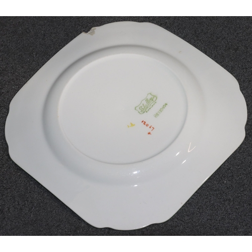 146 - A Shelley part dinner service on white and green ground with coloured floral and leaf decoration, co... 