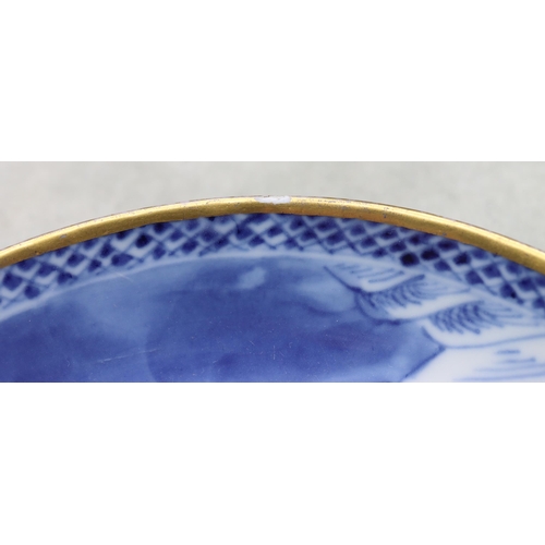 152 - An 18th Century Chinese blue and white cup and saucer with figure, river landscape and building deco... 