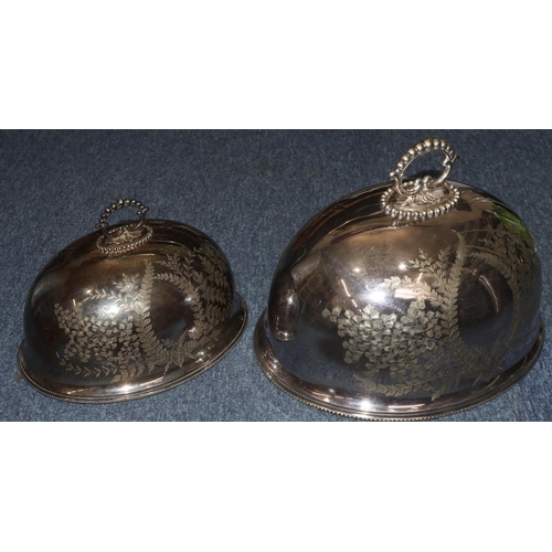 324 - A pair of silver plated oval bulbous shaped meat covers with engraved leaf decoration, 41cm x 33cm a... 