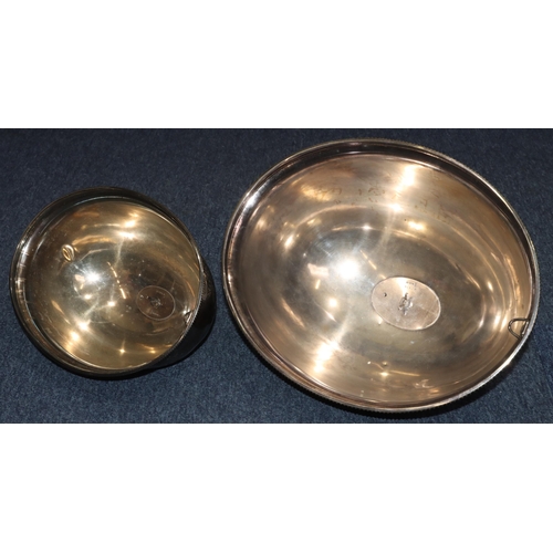 324 - A pair of silver plated oval bulbous shaped meat covers with engraved leaf decoration, 41cm x 33cm a... 