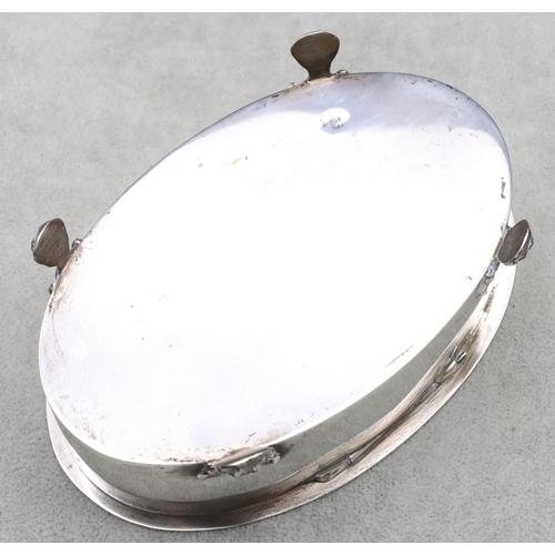 328 - A Continental oval silver coloured metal trinket box with hinged lid with floral and leaf decoration... 