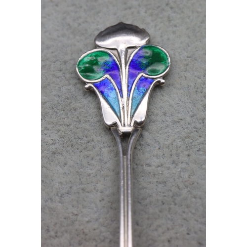 335 - An Edward VII James Fenton for Liberty & Co. silver and enamelled teaspoon with green, turquoise and... 