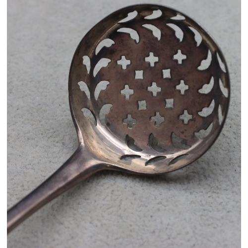 341 - A Georgian silver sifter spoon with engraved crest, maker's mark CB/TB, 0.82oz