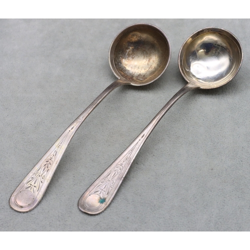 342 - A pair of Tostrup 830 silver coloured metal sauce ladles, dated 1884 with engraved handles, 1.8oz