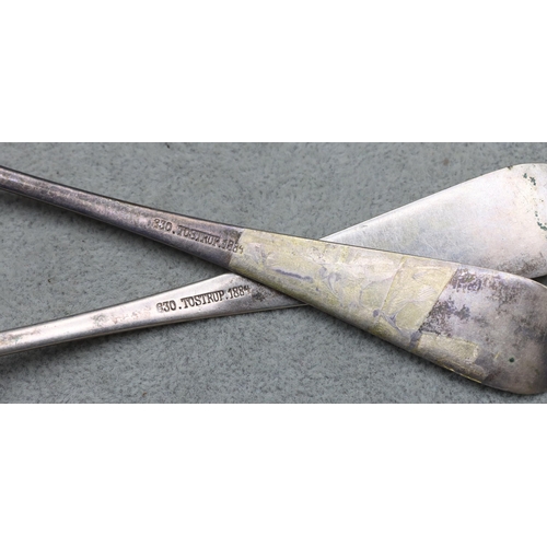 342 - A pair of Tostrup 830 silver coloured metal sauce ladles, dated 1884 with engraved handles, 1.8oz