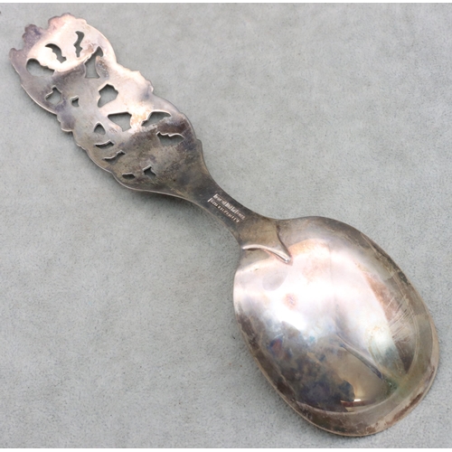 343 - R Elvesaeter 930 silver coloured metal serving spoon, with pierced and raised floral and scroll hand... 