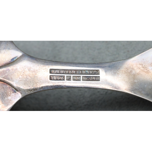 343 - R Elvesaeter 930 silver coloured metal serving spoon, with pierced and raised floral and scroll hand... 