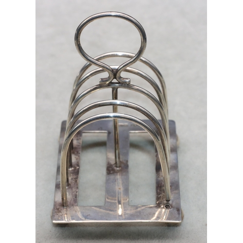 347 - A Mappin & Webb Sheffield silver 5-bar toast rack with centre ring handle on ball feet, 9cm wide, 3.... 