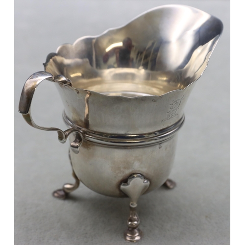 349 - An Edward VII Irish small cream jug with scroll handle on splayed hoof feet, Dublin 1906, 8cm high, ... 