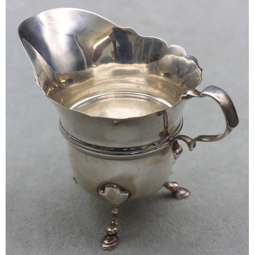 349 - An Edward VII Irish small cream jug with scroll handle on splayed hoof feet, Dublin 1906, 8cm high, ... 