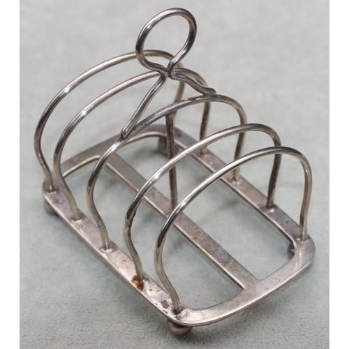 350 - A George VI silver 5-bar toast rack with centre ring handle on ball feet, London 1918, maker's mark ... 