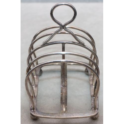 350 - A George VI silver 5-bar toast rack with centre ring handle on ball feet, London 1918, maker's mark ... 