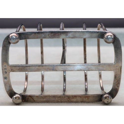 350 - A George VI silver 5-bar toast rack with centre ring handle on ball feet, London 1918, maker's mark ... 