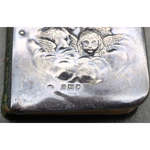 359 - An Edward VII small prayer book with embossed silver front, London 1903, embossed cupid head motifs