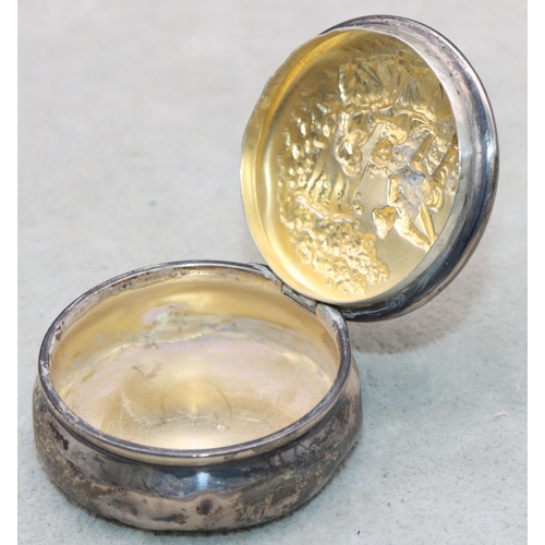 360 - An Edward VII silver round bulbous shaped snuff box with hinged lid with embossed figure motifs, 4.7... 