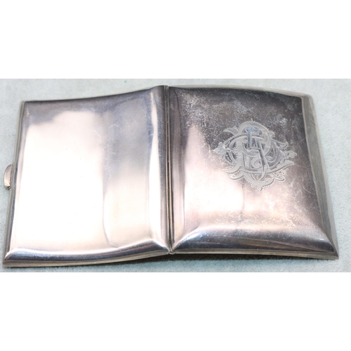 362 - An Edward VII small silver plain concave shaped cigarette case with hinged front engraved with monog... 