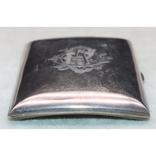 362 - An Edward VII small silver plain concave shaped cigarette case with hinged front engraved with monog... 