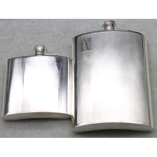 368 - An EPNS concave shaped large hip flask with engine turned decoration, 16.5cm high and a plain silver... 