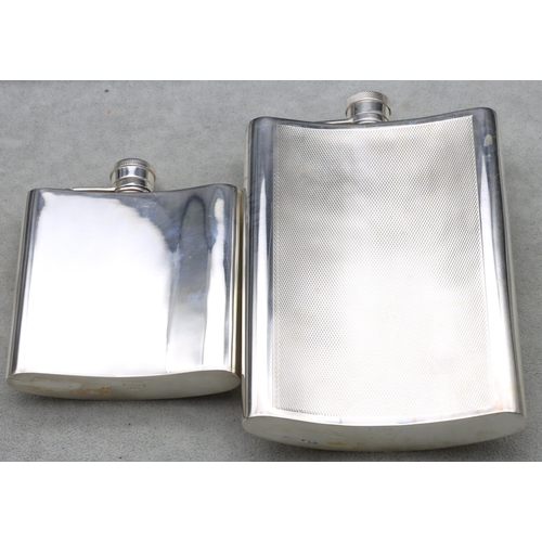 368 - An EPNS concave shaped large hip flask with engine turned decoration, 16.5cm high and a plain silver... 