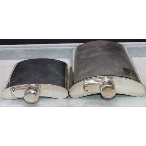 368 - An EPNS concave shaped large hip flask with engine turned decoration, 16.5cm high and a plain silver... 