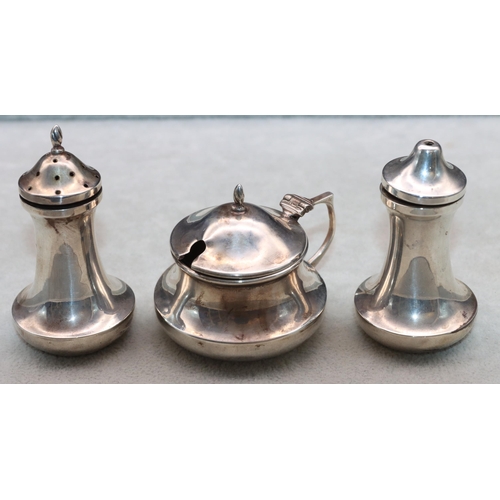 371 - A 3-piece Birmingham silver round bulbous shaped condiment set comprising of mustard with blue glass... 