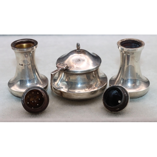 371 - A 3-piece Birmingham silver round bulbous shaped condiment set comprising of mustard with blue glass... 