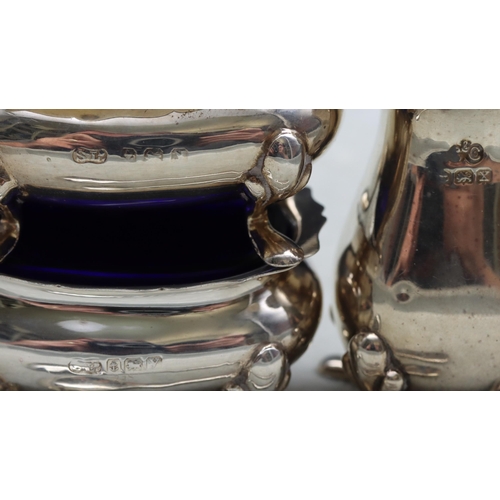 374 - A 3-piece Birmingham silver rectangular bulbous shaped condiment set comprising of mustard with blue... 