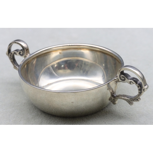 378 - A George V silver round 2-handled bleeding bowl, Sheffield 1936, maker E. Viner, 12cm wide, 2.3oz