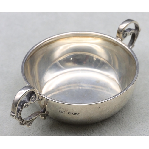 378 - A George V silver round 2-handled bleeding bowl, Sheffield 1936, maker E. Viner, 12cm wide, 2.3oz