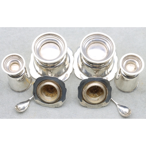 396 - A 4-piece Sheffield silver condiment set comprising of a pair of salts with blue glass liners and sp... 