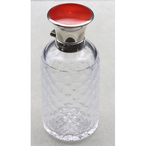 397 - A cut glass round scent bottle with thumb pattern decoration, Birmingham silver neck and hinged lid ... 