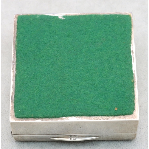 402 - A London silver square cigarette box with engine turned hinged lid enclosing a cedar lined interior,... 