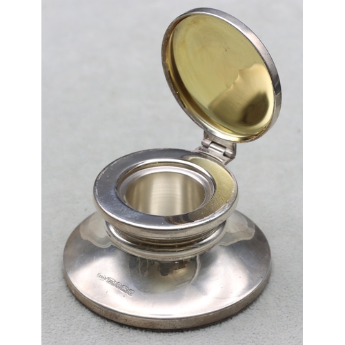 405 - A modern Birmingham 925 silver inkwell with hinged lid on round splayed base, 7.1cm diameter