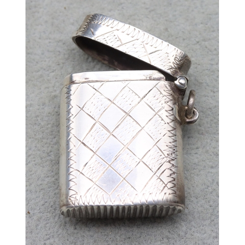 415 - A sterling silver vesta case with hinged lid, stamped 