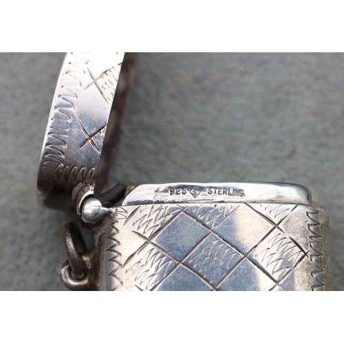 415 - A sterling silver vesta case with hinged lid, stamped 