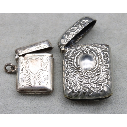 416 - A 925 small silver vesta case with hinged lid (damage to lid) and a silver plated embossed vesta cas... 