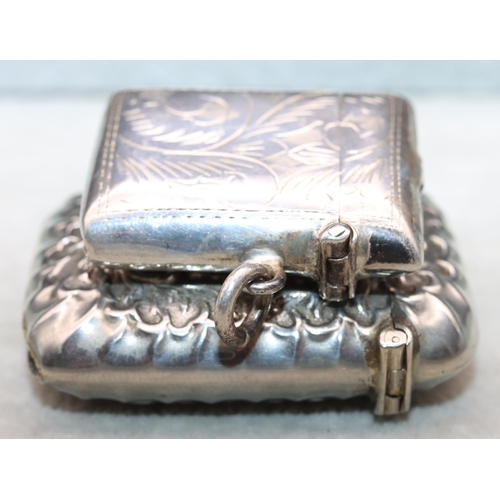 416 - A 925 small silver vesta case with hinged lid (damage to lid) and a silver plated embossed vesta cas... 