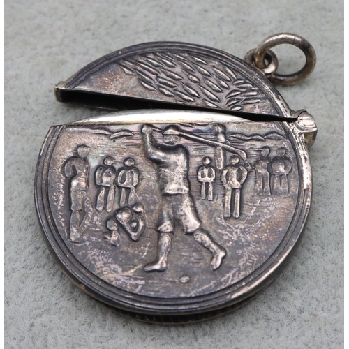 418 - A circular golfing vesta case with hinged lid and allover embossed figure playing golf