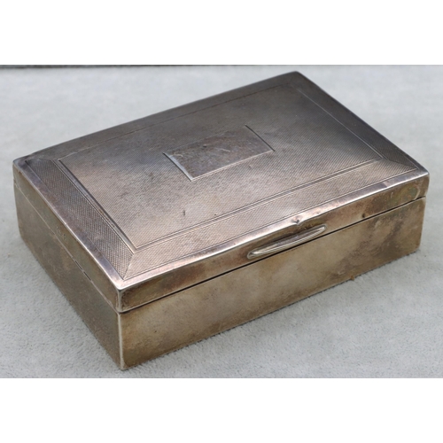 419 - A Birmingham silver rectangular shaped cigarette box with engine turned hinged lid enclosing cedar l... 