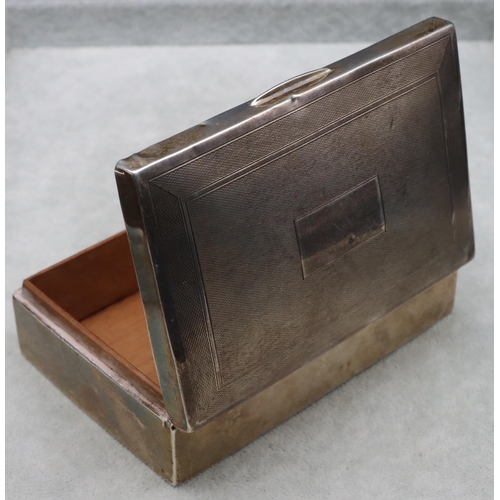 419 - A Birmingham silver rectangular shaped cigarette box with engine turned hinged lid enclosing cedar l... 