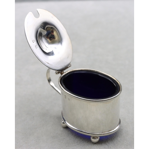 424 - A Victorian Birmingham silver oval mustard pot with hinged lid enclosing blue glass liner, 1.3oz