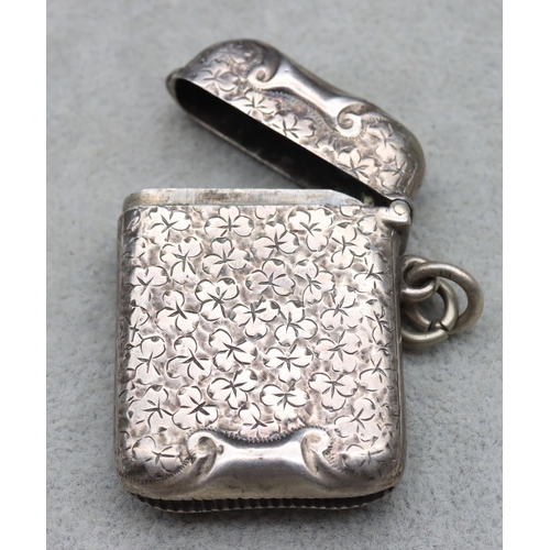 434 - A Victorian silver vesta case with allover leaf and scroll decoration, hinged lid